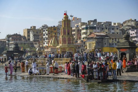 Photo for Nashik, India - January 25, 2024: People making offerings at the Ganga Ghat in Nashik, India. - Royalty Free Image