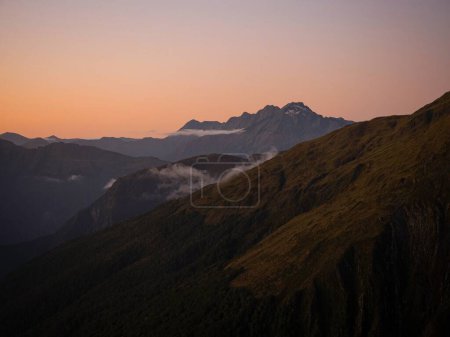 Photo for Alpine mountain valley sunset, nature landscape panorama seen from Mount Armstrong Brewster Hut West Coast Otago Southern Alps South Island New Zealand - Royalty Free Image