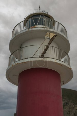 View from below of the lighthouse of Cabo Ortegal on a cloudy day, in Coruna, Galicia.