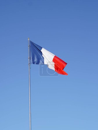 French flag against blue sky. Flag of France