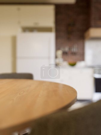 Photo for Kitchen with an emphasis on the surface of the kitchen table with a blurred background - a place to place products. L-shaped kitchen with beams and dining table. 3D rendering - Royalty Free Image