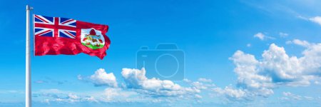 Photo for Bermuda Flag - state of America, flag waving on a blue sky in beautiful clouds - Horizontal banner - Royalty Free Image