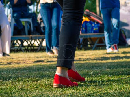 Photo for People dancing typical Catalan sardanas in a park during a traditional national holiday. Empty space for editor's text. - Royalty Free Image