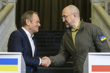 Photo for Polish Prime Minister Donald Tusk and Ukrainian Prime Minister Denys Shmyhal are shaking hands after a joint press conference in Kyiv, Ukraine, on January 22, 2024. High quality photo - Royalty Free Image