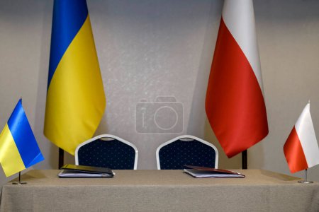 Photo for National flags of Ukraine and Poland at the table for signing a bilateral agreement, document, contract. High quality photo - Royalty Free Image