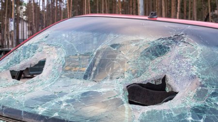 Broken windshield from a car accident. The windshield of the car was broken. Broken windproof car accident. Car accident. A window repair company will come to you to replace the broken glass