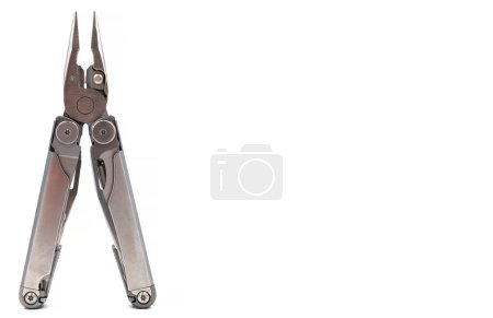 Photo for One modern gray iron open folding multifunctional knife isolated on a white background. Multitool with extended tools and pliers. Compact and portable product. Pocket knife. EDC concept - Royalty Free Image
