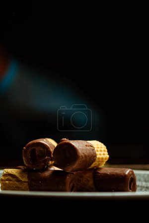 Photo for Closeup of rolled wafers with chocolate - Royalty Free Image