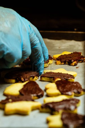 Photo for Closeup of chef preparing chocolate cookies - Royalty Free Image