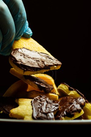 Photo for Closeup of chef holding chocolate cookies - Royalty Free Image