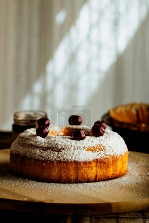 Photo for Homemade sweet cake, sprinkled sugar powder with cherries - Royalty Free Image