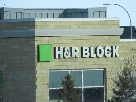 Photo for Calgary, Alberta, Canada. Jan 10, 2023. H and R Block building signage of a building. - Royalty Free Image