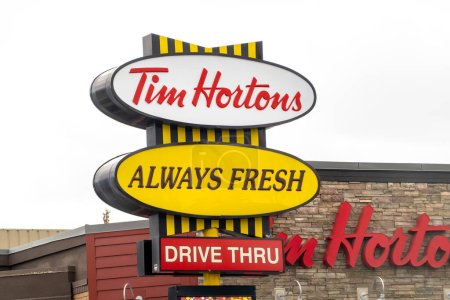 Photo for Calgary, Alberta, Canada. Apr 04, 2023. A Tim Hortons, always fresh and drive thru sign. - Royalty Free Image
