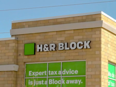 Photo for Calgary, Alberta, Canada. Apr 30, 2023. A front view of a H and R Block location. Concept: Tax Season - Royalty Free Image