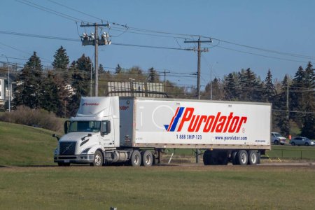 Photo for Calgary, Alberta, Canada. May 12, 2023. A Purolator trailer truck on a highway. - Royalty Free Image