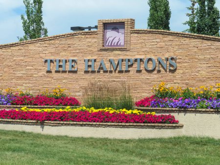 Photo for Calgary, Alberta, Canada. July 22, 2023. A Welcome sign with the text: THE HAMPTONS a residential neighbourhood in the northwest quadrant of Calgary. - Royalty Free Image