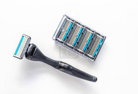 A razor with a metal handle and four six-blade razor cartridges.