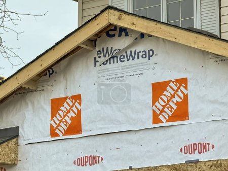 Photo for Calgary, Alberta, Canada. Dec 16, 2023. A close up to an under construction home wrap made by The Home Depot. Concept: Construction house material prices. - Royalty Free Image