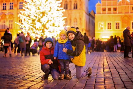 Photo for Child in Prague on Christmas, christmas lights and decoration on the square - Royalty Free Image