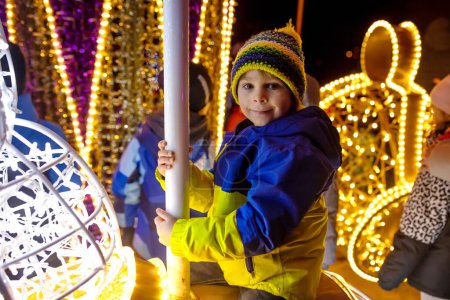 Photo for Cute child, boy, watching at lights in light show park, closeup - Royalty Free Image