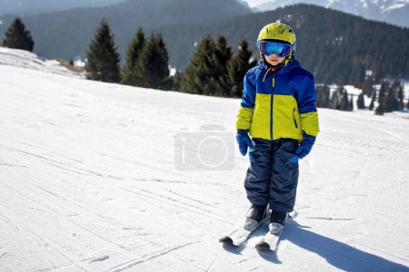 Photo for Happy family, skiing in Italy on a sunny day, kids and adults skiing together. Family vacation - Royalty Free Image