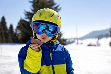 Photo for Happy family, skiing in Italy on a sunny day, kids and adults skiing together. Family vacation - Royalty Free Image