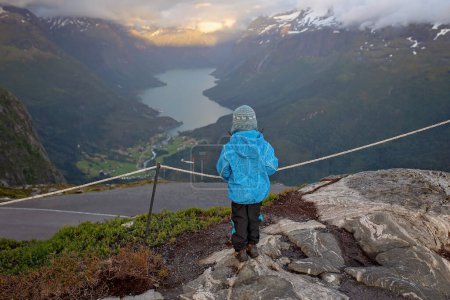 Foto de People, adult with kids and pet dog, hiking mount Hoven, enjoying the splendid view over Nordfjord from the Loen skylift - Imagen libre de derechos