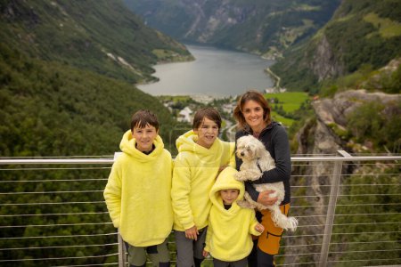 Photo for Family, kids and adults and a pet dog, enjoying trip to Geirangerfjord, amazing nature in Norway summertime - Royalty Free Image