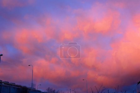 Photo for Amazing pink and purple sky after the rain with a hint of rainbow, springtime - Royalty Free Image