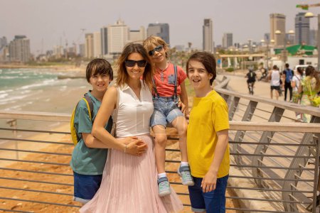 Photo for European tourist family with children, visiting Tel Aviv, Israel, enjoying day walk in the city - Royalty Free Image