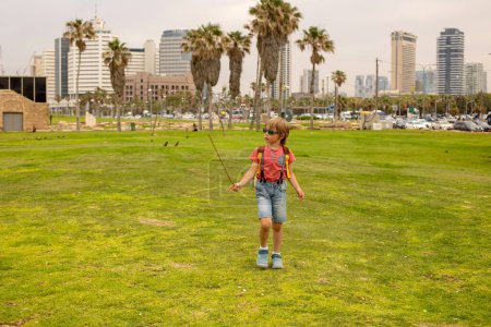 Photo for European tourist family with children, visiting Tel Aviv, Israel, enjoying day walk in the city - Royalty Free Image