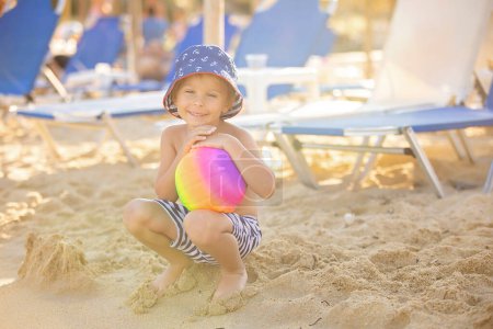 Photo for Happy child on the beach, enjoying summer, playing. Greece, Halkidiki - Royalty Free Image