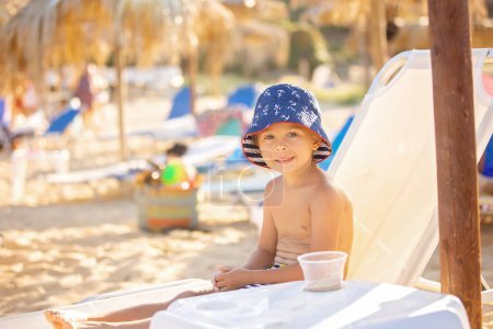 Photo for Happy child on the beach, enjoying summer, playing. Greece, Halkidiki - Royalty Free Image