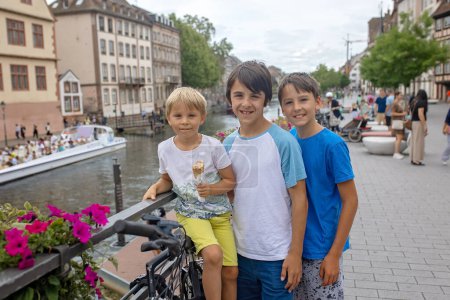 Photo for Beautiful family with children, boys, visiting Strasbourg in France during summer vacation - Royalty Free Image
