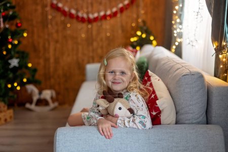 Photo for Beautiful children, blond kids, siblings, playing in decorated home for Christmas, enjoying holidays at home - Royalty Free Image