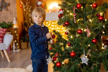 Photo for Grandmother and child at home on christmas, reading, writing letter, baking, enjoying the xmas holidays - Royalty Free Image