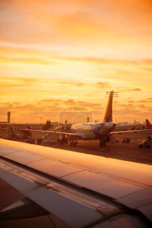 Photo for Beautiful sunset over the airport from a plane window on taking off over Tel Aviv - Royalty Free Image