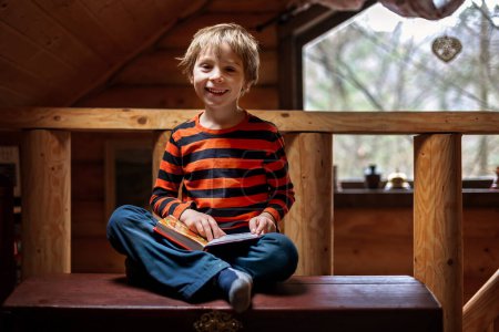 Cute child, boy in an rural village cottage