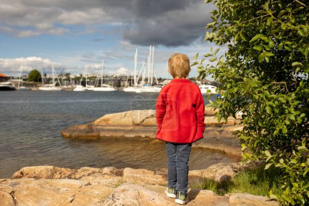 Beautiful town Kristiansand in Norway, family visiting Norway for summer vacation, kids enjoying amazing views