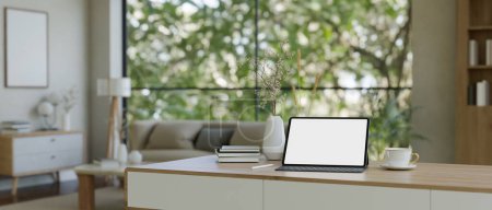 Photo for Home workspace in minimal beautiful living room with portable tablet white screen mockup, wireless keyboard and decor. 3d render, 3d illustration - Royalty Free Image