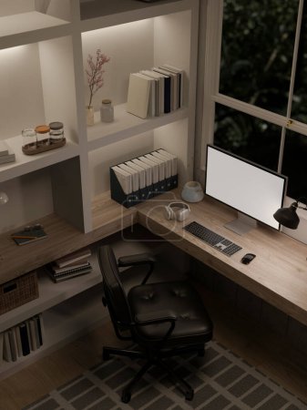 Photo for Top view of a modern luxury home office at night with a computer white screen mockup on a table against the window and large built-in shelves. 3d render, 3d illustration - Royalty Free Image
