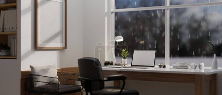 Photo for Modern, minimal home office workspace with a laptop white screen mockup on a table against the window on a rainy day. 3d render, 3d illustration - Royalty Free Image