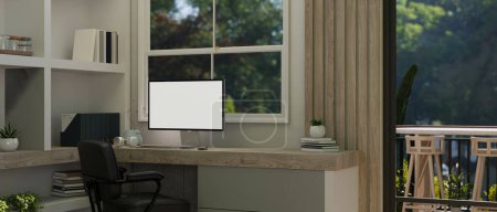 Photo for A white screen computer mockup on a desk against the window in a modern home office room. 3d render, 3d illustration - Royalty Free Image