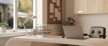 Photo for A modern office workspace or home office, a laptop computer, a table lamp, a document tray, and a pencil stand on a desk in a modern office room. 3d render, 3d illustration - Royalty Free Image