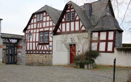 Photo for Traditional timber-framed house with wooden gate in the heart of the old town, at Domplatz, Limburg an der Lahn, Germany - January 24, 2023 - Royalty Free Image