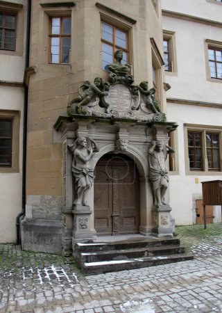 Photo for Sculptured portal of the renaissance building of the Old Gymnasium, at Kirchplatz 13, built in 1589, Rothenburg ob der Tauber, Germany - February 6, 2023 - Royalty Free Image