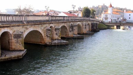 The Old Bridge, Ponte Velha, the larges stone bridge in Portugal, across Nabanus River, in the old town, Tomar, Portugal - February 6, 2024