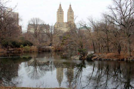 Photo for The Lake and skyline of the Upper West Side, The Eldorado, iconic Art Deco building, in the center, view in the Central Park on snowless winter afternoon, New York, NY, USA - December 23, 2023 - Royalty Free Image