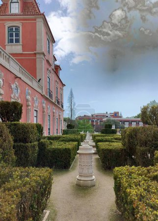 Marques de Pombal Palace, built in second half of the 18th century in Baroque and Rococo styles, garden side view with manicured hedges, Oeiras, Lisbon, Portugal - March 5, 2024