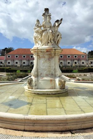 Four Seasons Fountain in the gardens of Marques de Pombal Palace, palatial complex built in second half of the 18th century in Baroque and Rococo styles, Oeiras, Lisbon, Portugal - March 5, 2024